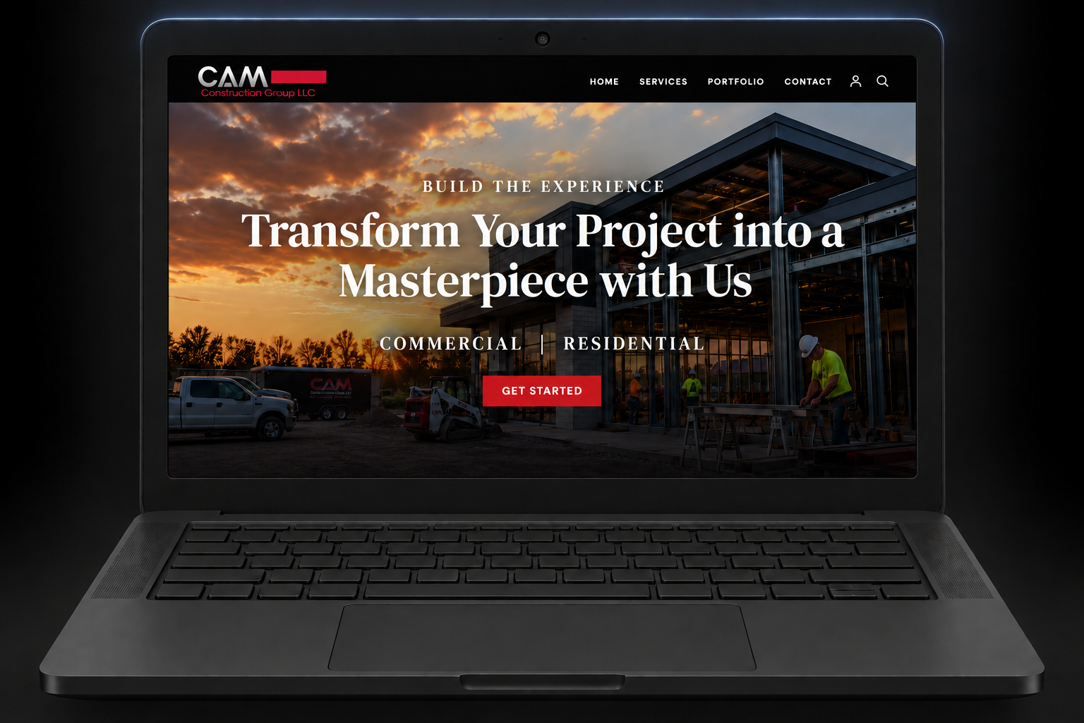 CAM Construction Group website in a dark laptop with a subtle top-edge glow